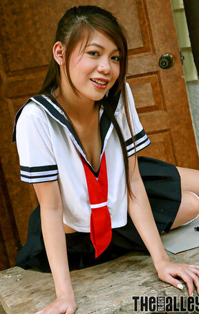 Patricia Tsang strips kogal uniform and upskirt flashes pussy